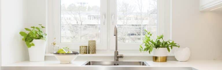 kitchen sink below window in a modern fancy scandinavian design kitchen