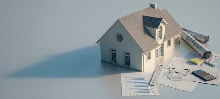 A home with papers and a calculator on a table, indicating ongoing home projects.