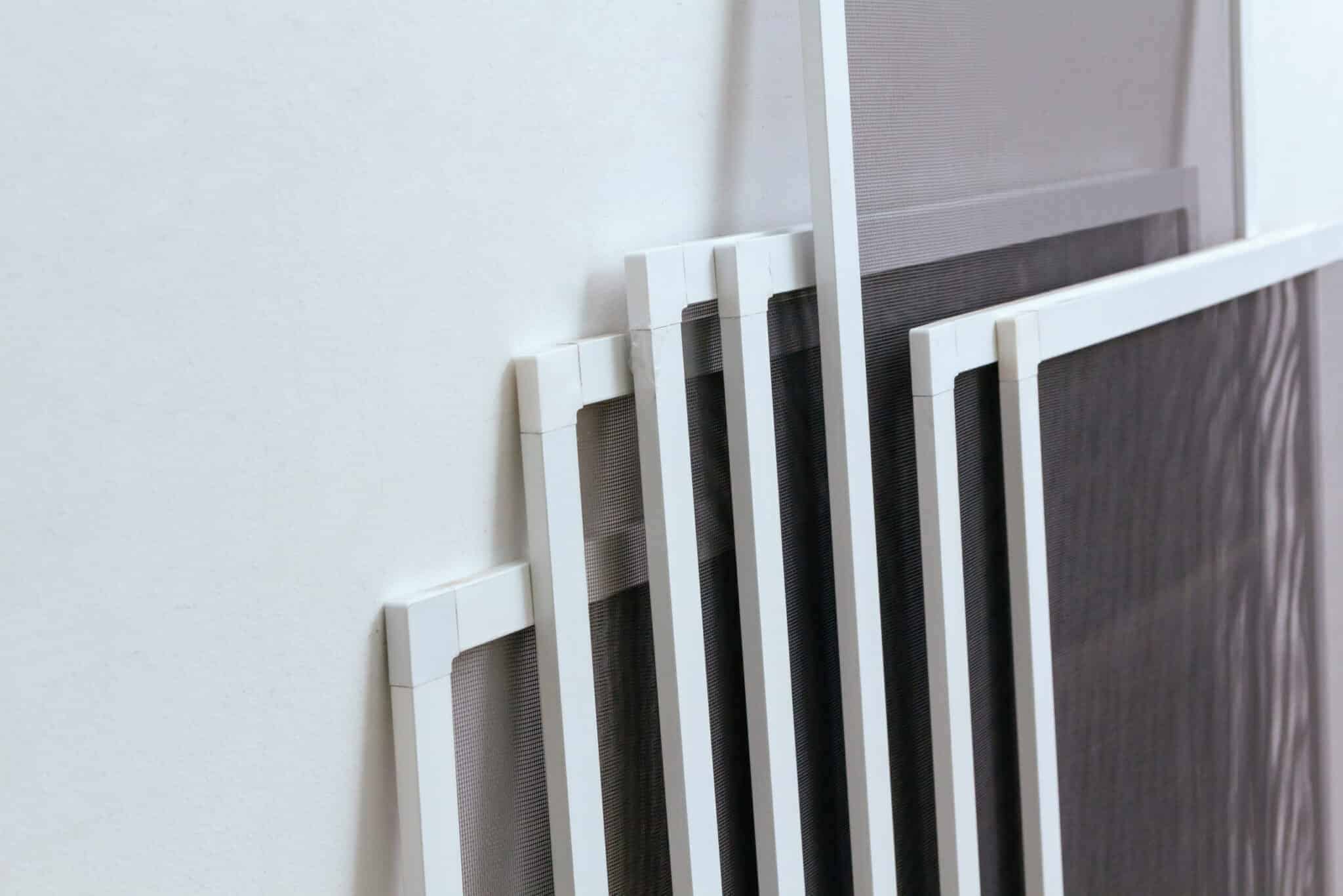 A group of energy-efficient black and white frames on a white wall.